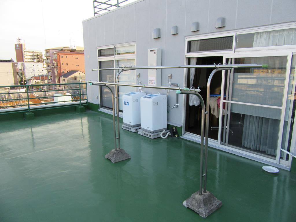 Guesthouse Tiga Kumamoto Szoba fotó