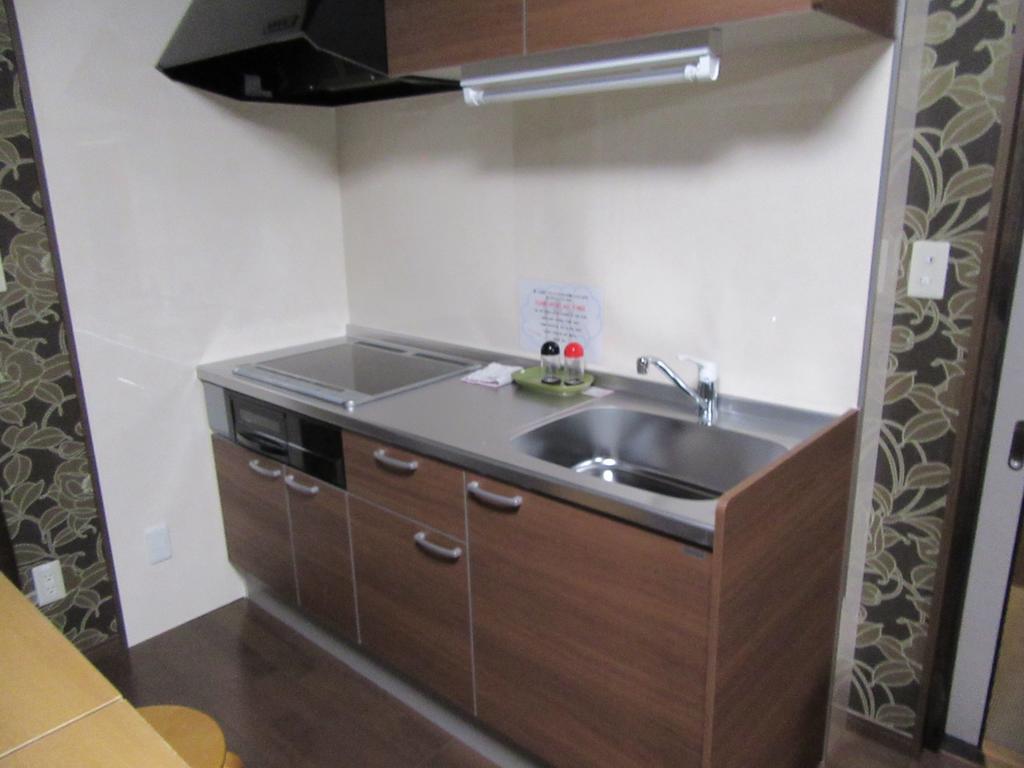 Guesthouse Tiga Kumamoto Szoba fotó